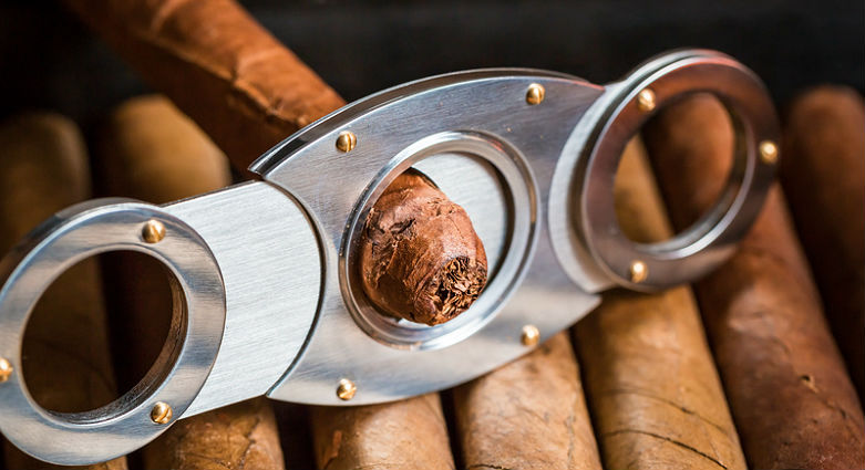 How to cut and light a cigar.