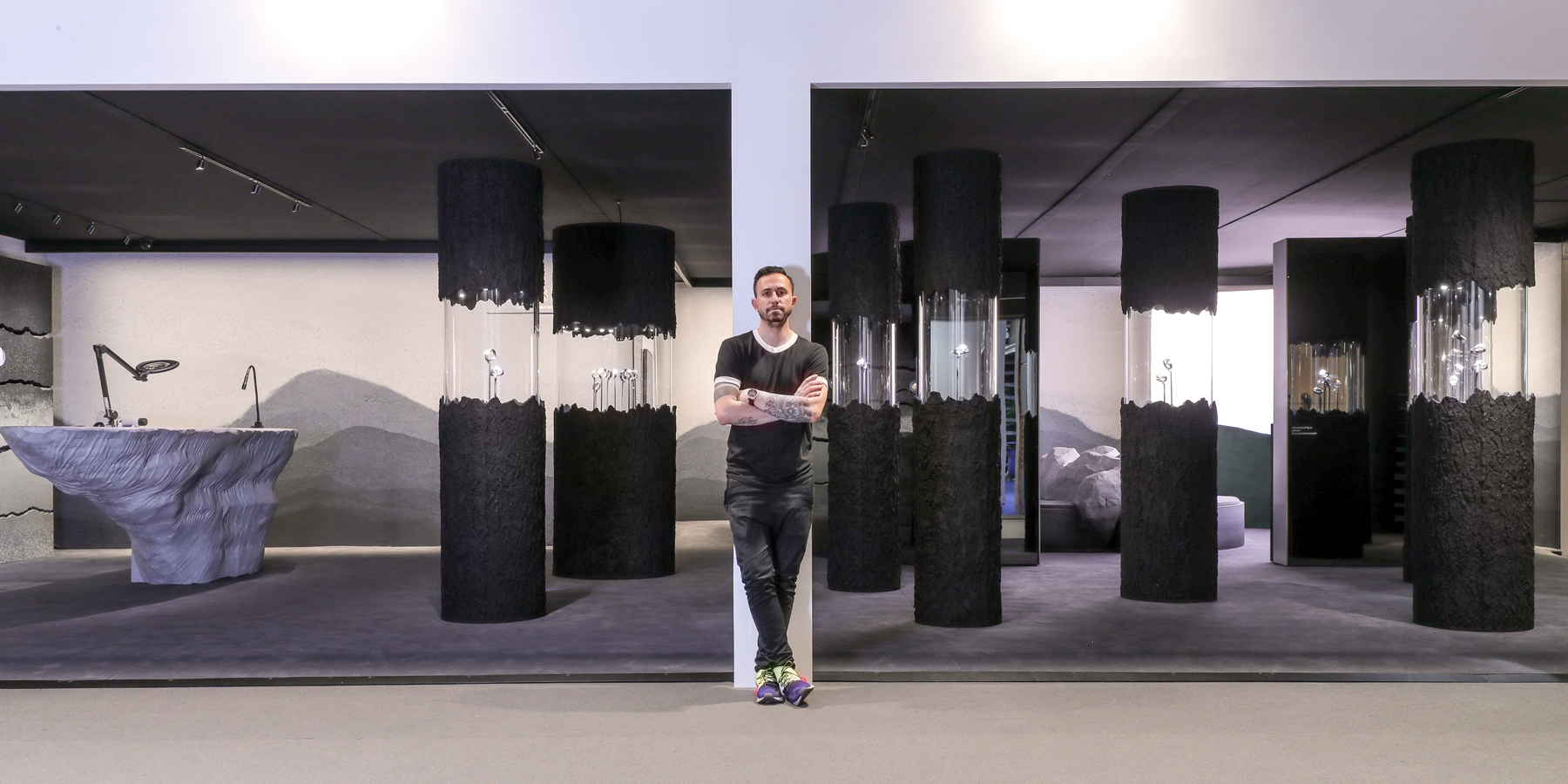 Fernando Mastrangelo standing in front of Audemars Piguet exhibition.