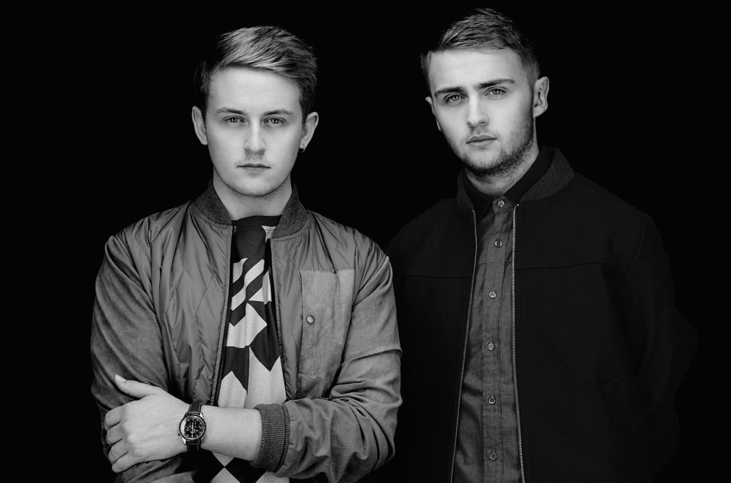 Disclosure facing the camera in black and white.