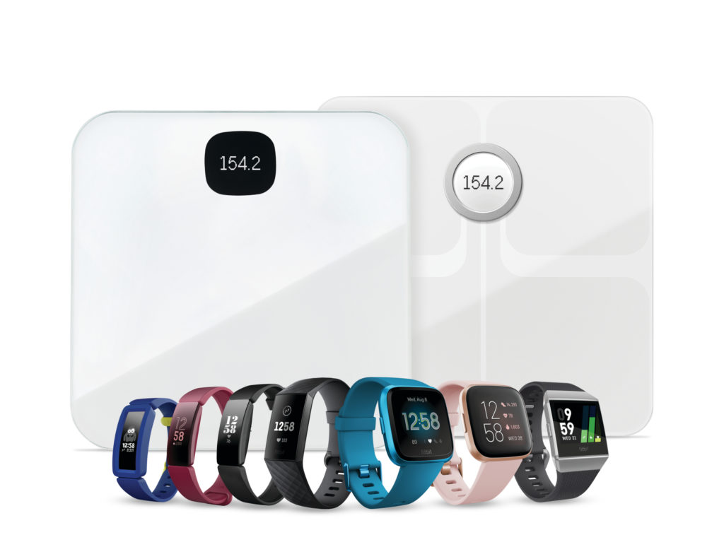 Fitbit's full lineup of items including all the watches, fitness trackers and scales on a white background.