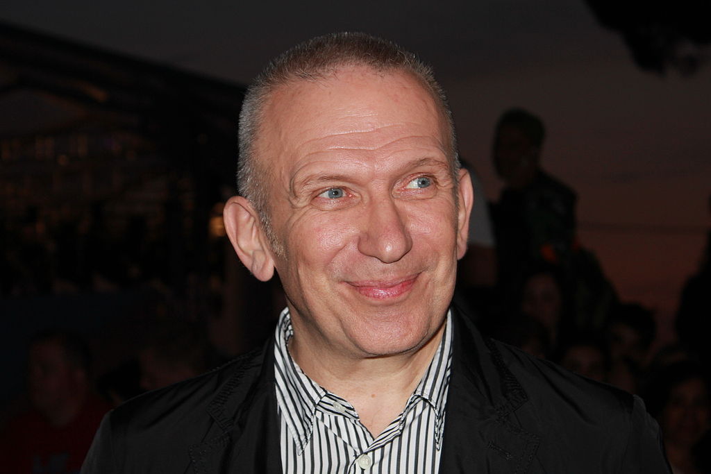 Jean Paul Gaultier wearing shirt and dark jacket.