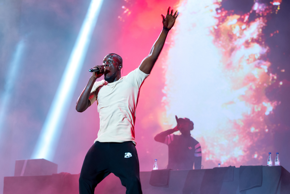 Stormzy performing on stage.