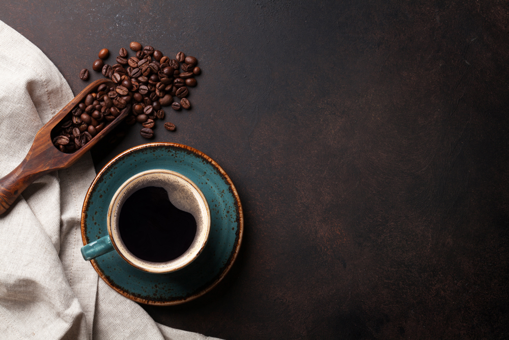 Coffee cup and beans from an aerial view.