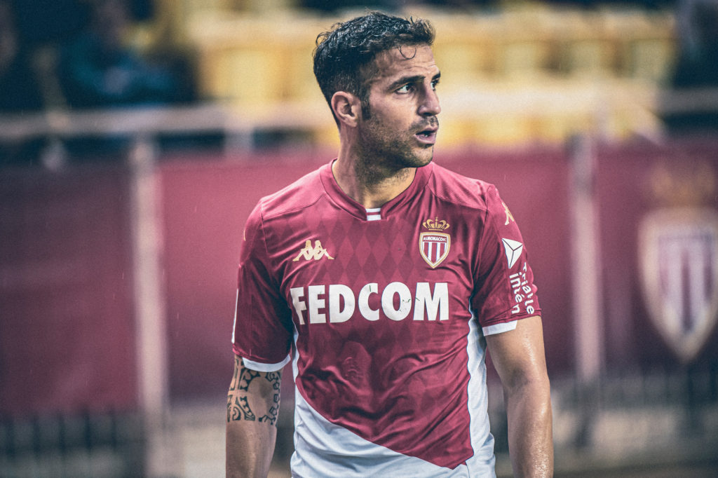 Cesc Fabregas wearing AS Monaco shirt.