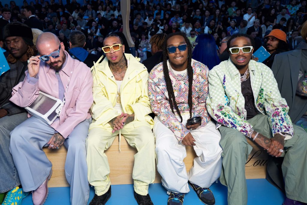 J Balvin, Tyga and Migos take in the action at Louis Vuitton.