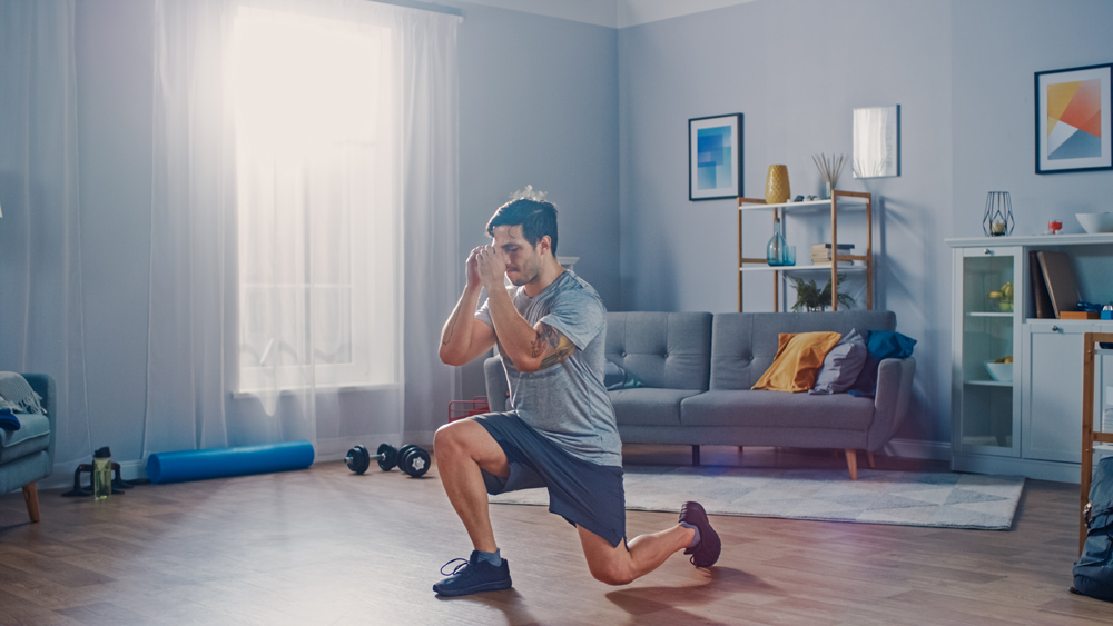 Man working out in his living room.